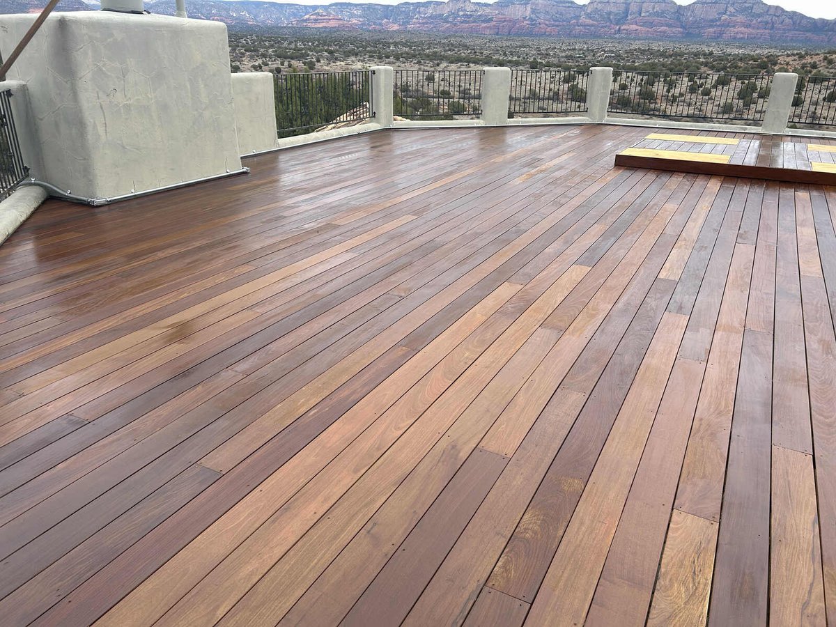 Glossy hardwood deck with expansive desert views, crafted by Crosby Home Services in Prescott, AZ