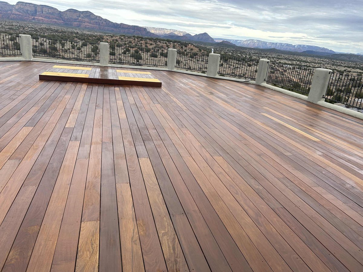 Shiny hardwood rooftop deck in Prescott, AZ, showcasing panoramic mountain views, crafted by Crosby Home Services