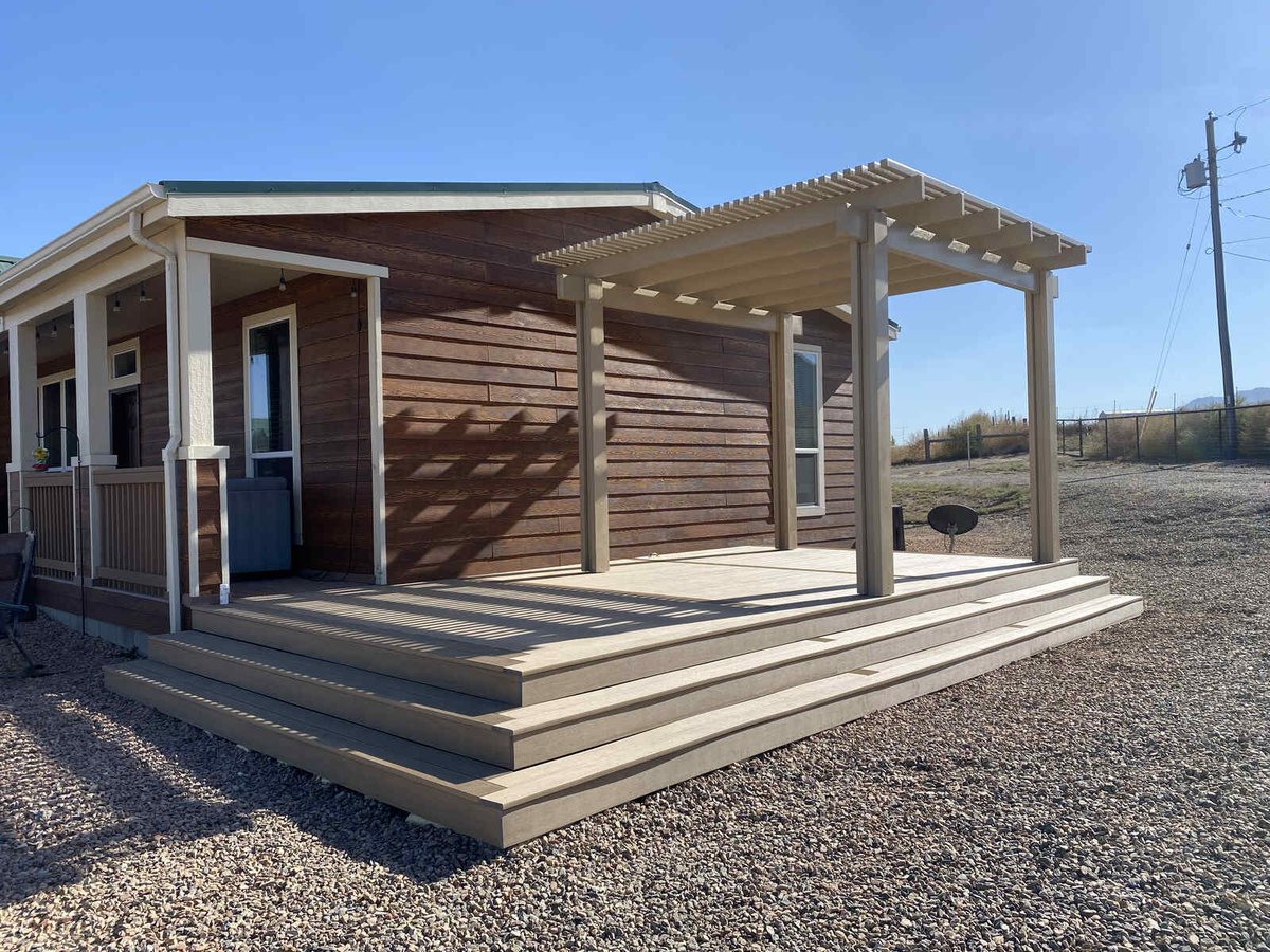 Side view of a wooden deck and pergola installation by Crosby Home Services in Prescott, AZ